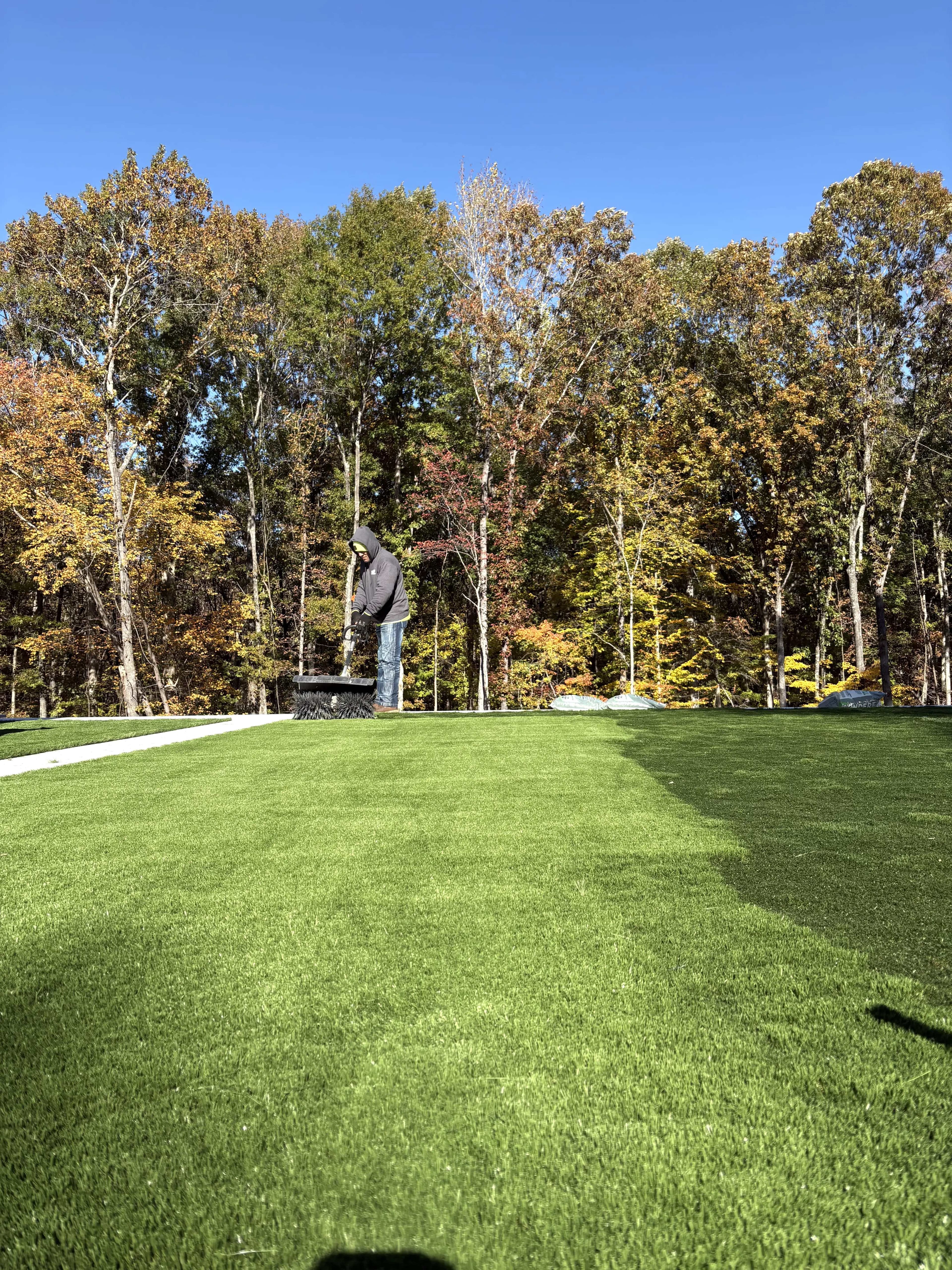Atlantic Turf Specialists crew installing commercial turf on site