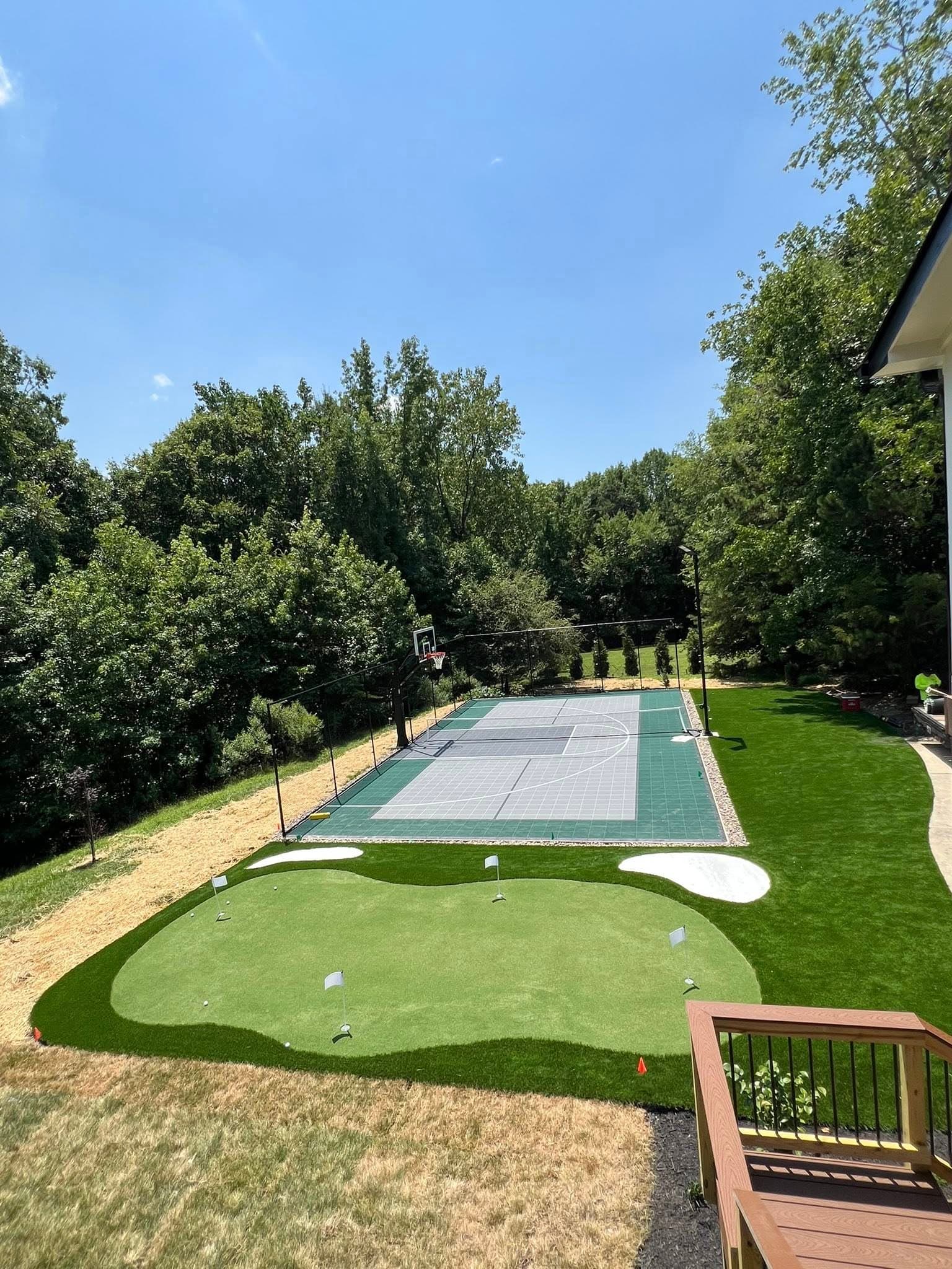 Backyard tennis court and putting green combination