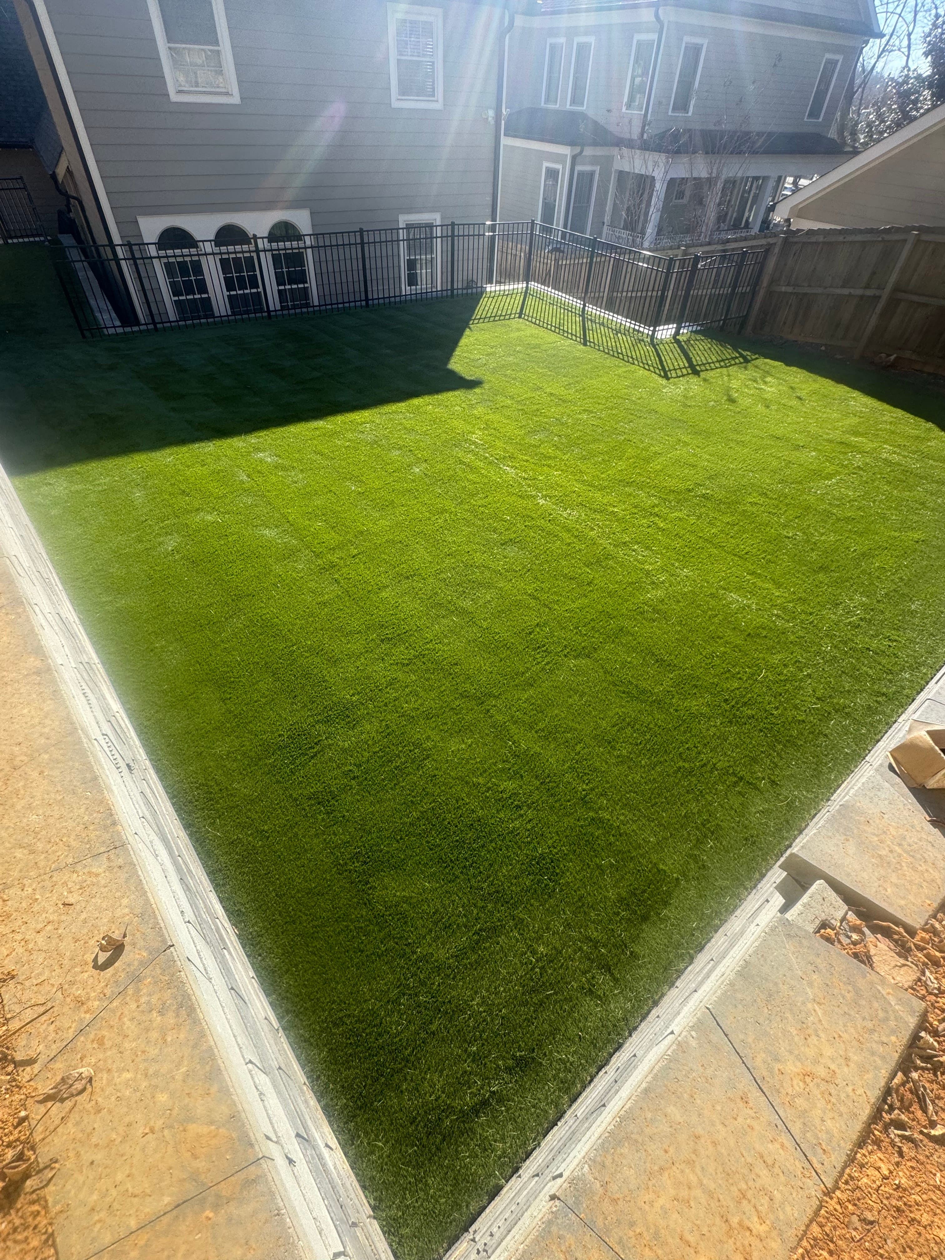 Low maintenance backyard turf installation