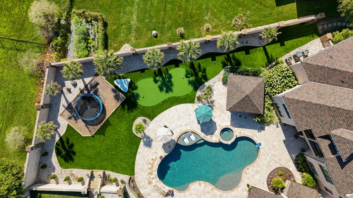 Aerial Estate View: Turf, Pool & Putting Green