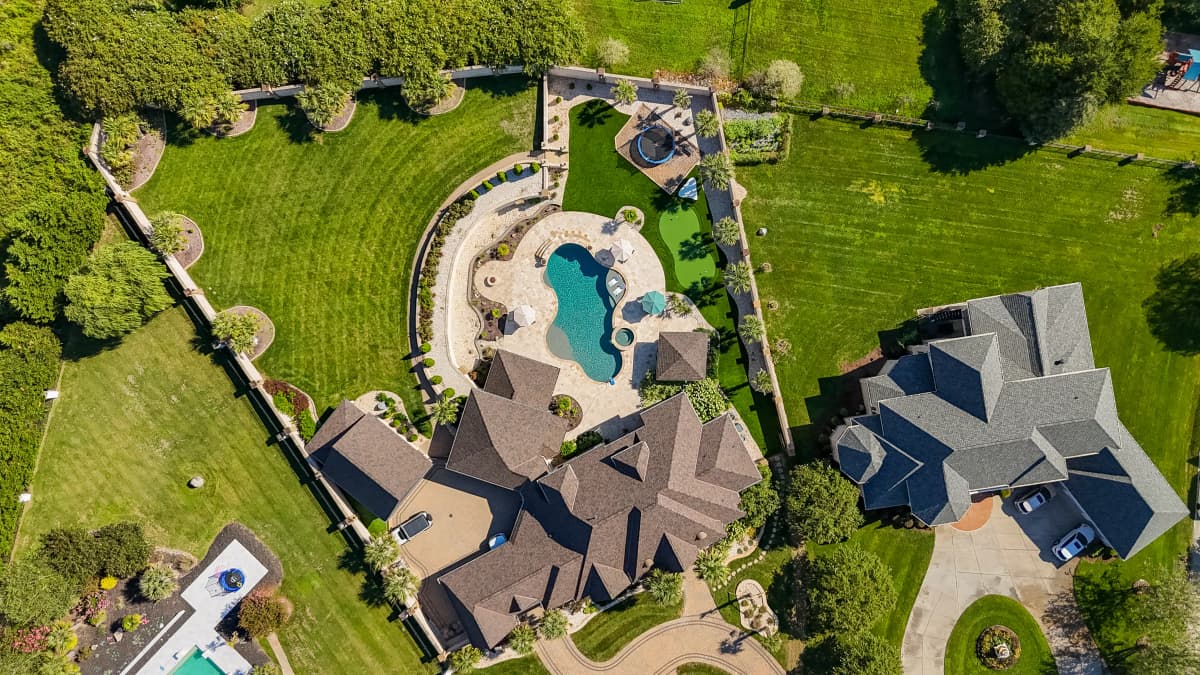 Wide Aerial Estate: Acreage Turf & Pool