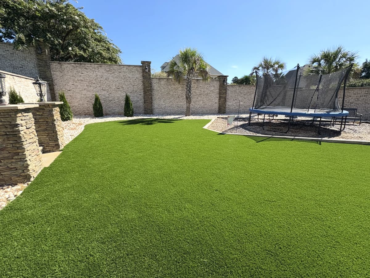 Residential Backyard Turf with Trampoline Area