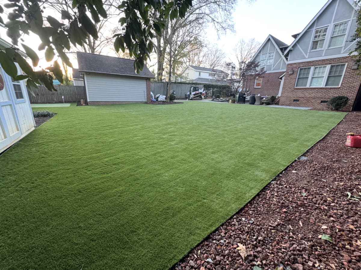 Wide Residential Backyard at Dusk