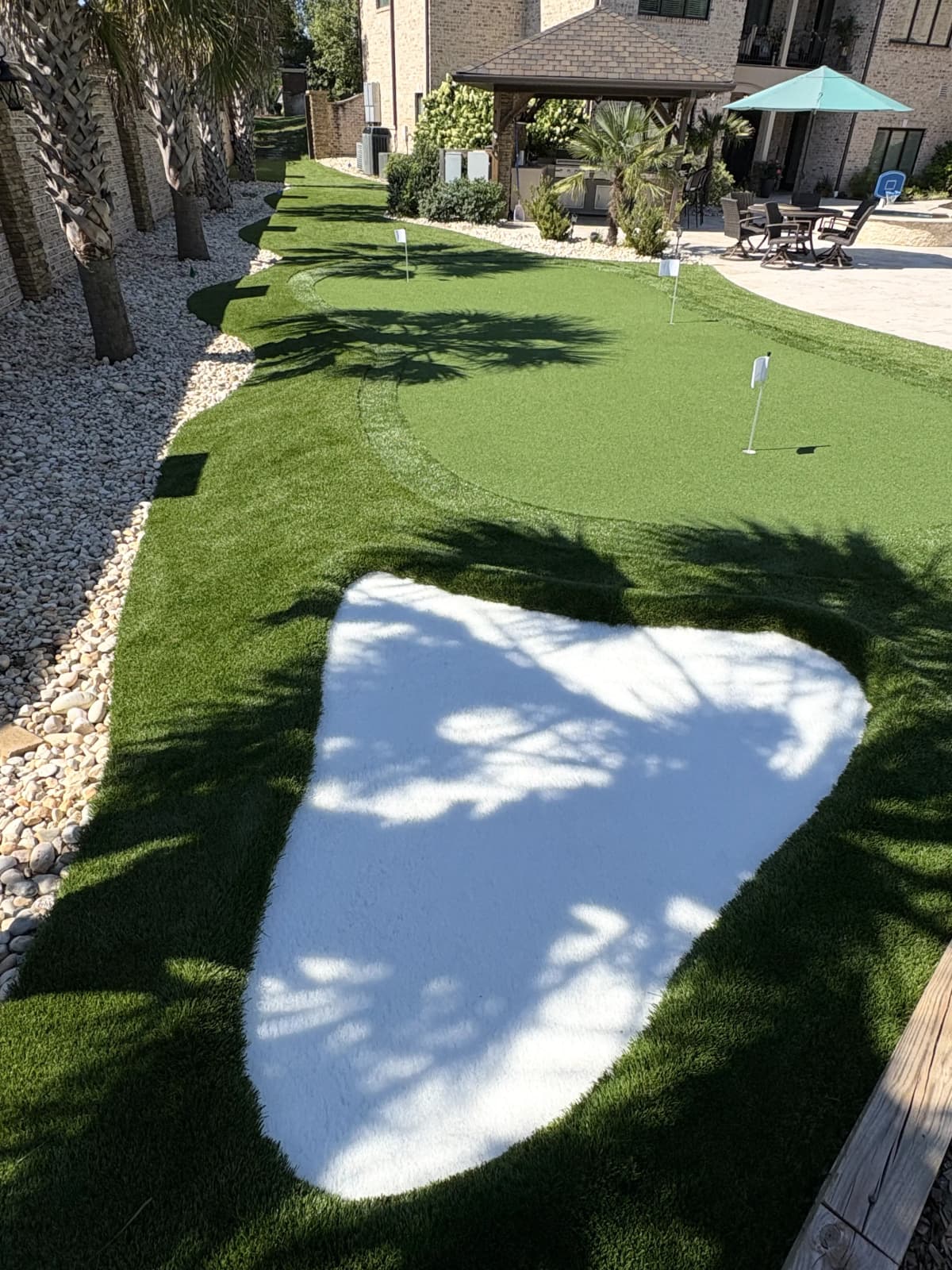 Multi-Hole Putting Green — Palm Tree Courtyard