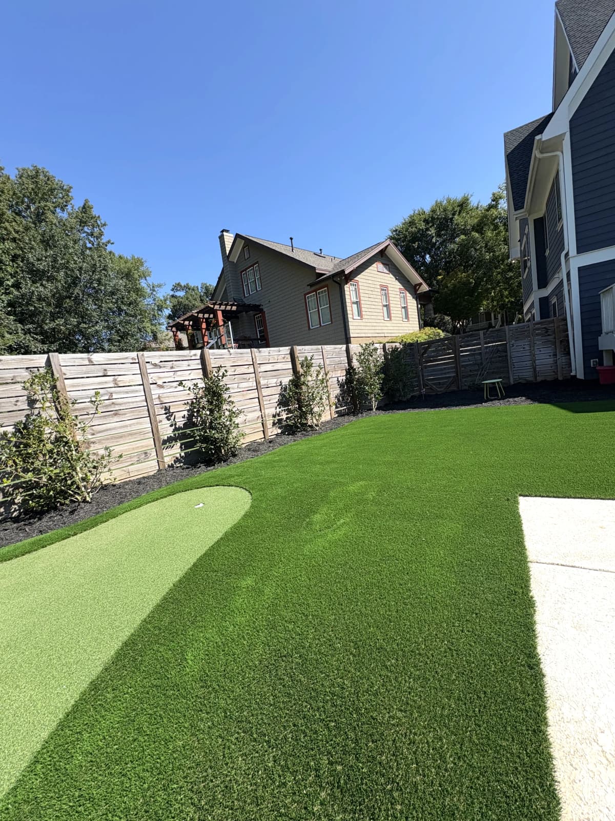 Putting Green & Backyard Lawn — Fenced Suburban