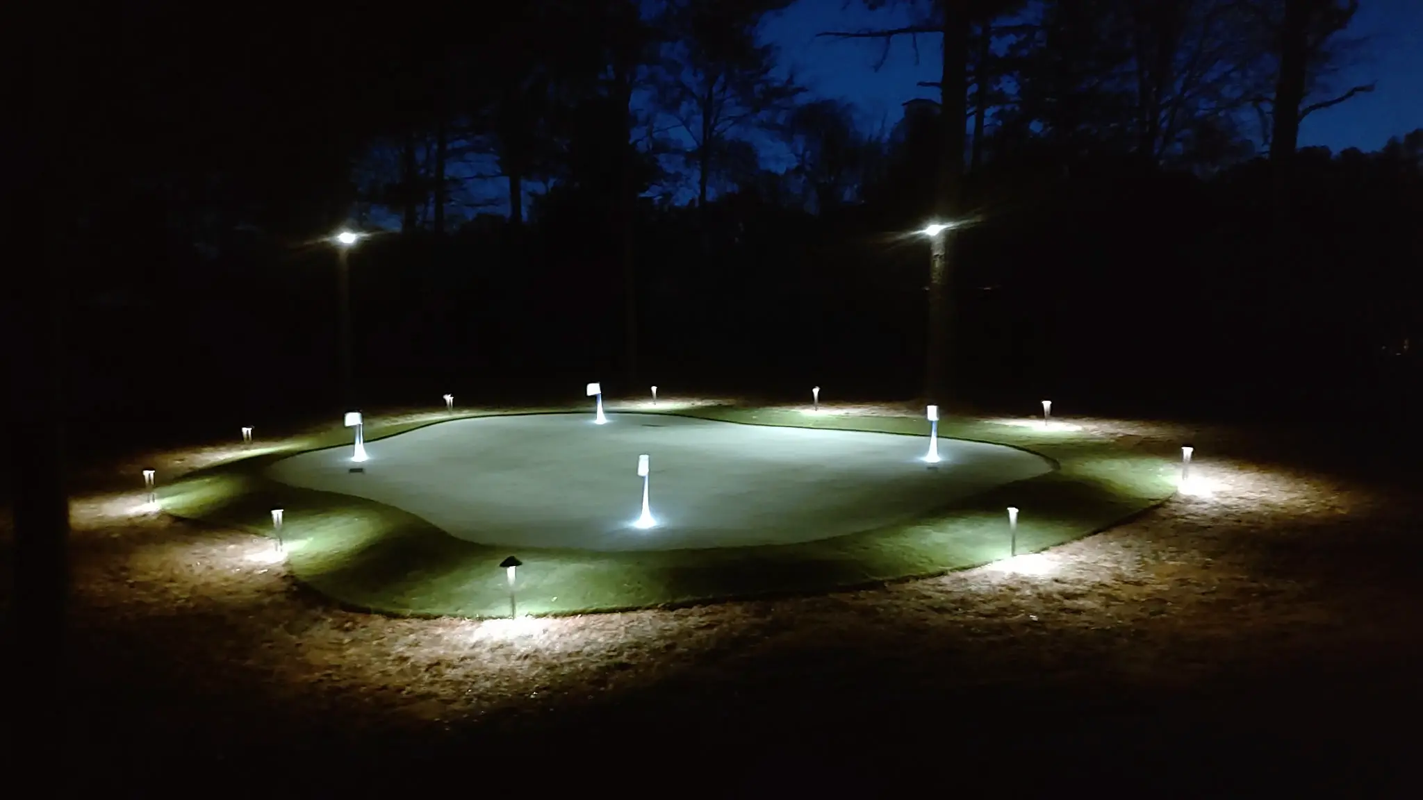 Custom multi-hole putting green with night lighting — Charlotte NC