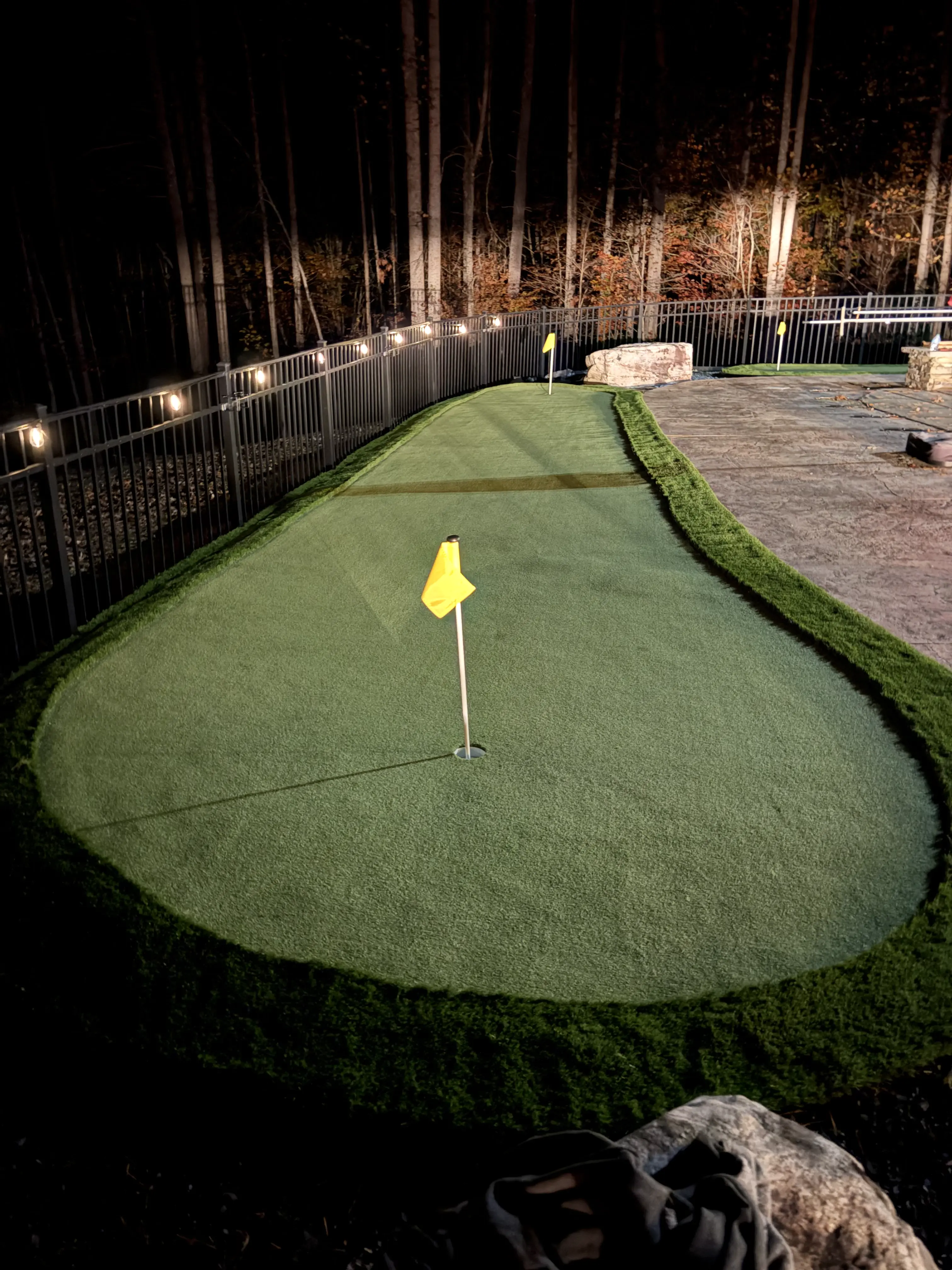 Putting Green — Night Lit, Iron Fence & Fire Pit